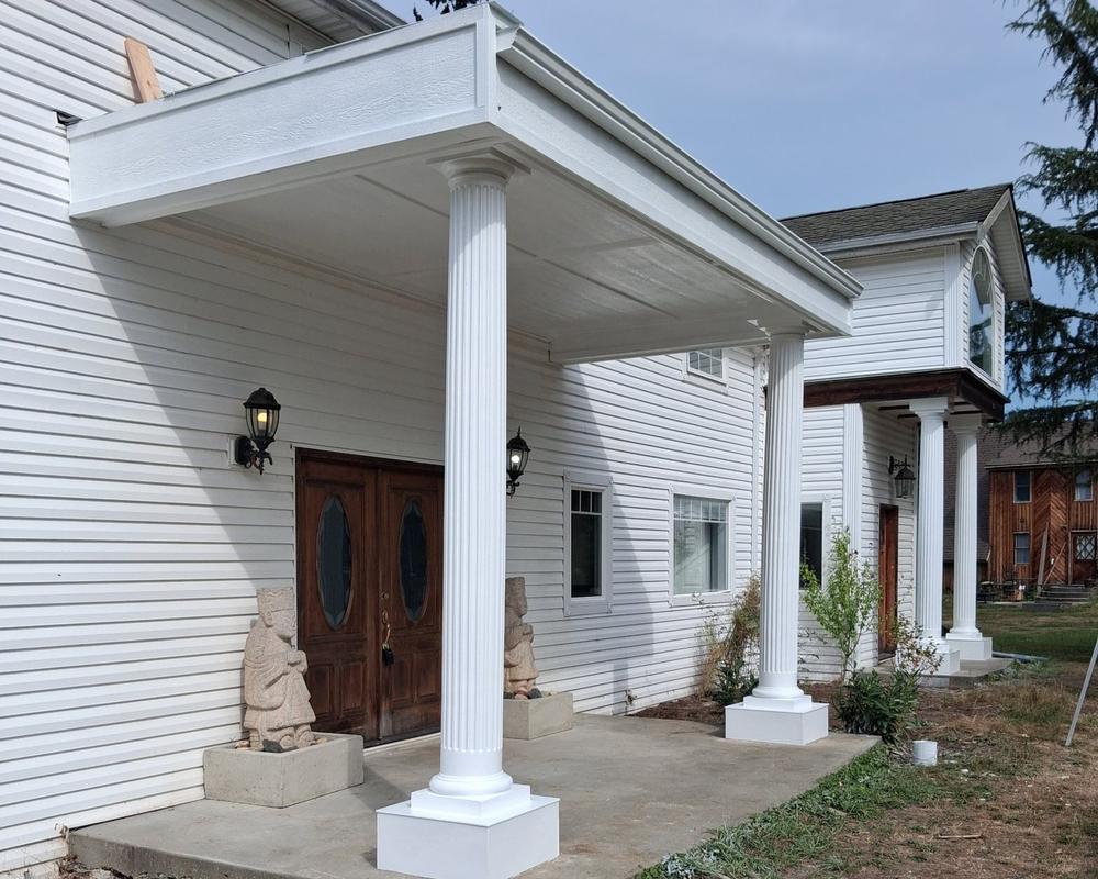 Front porch columns, ceiling and fascia freshly painted white
